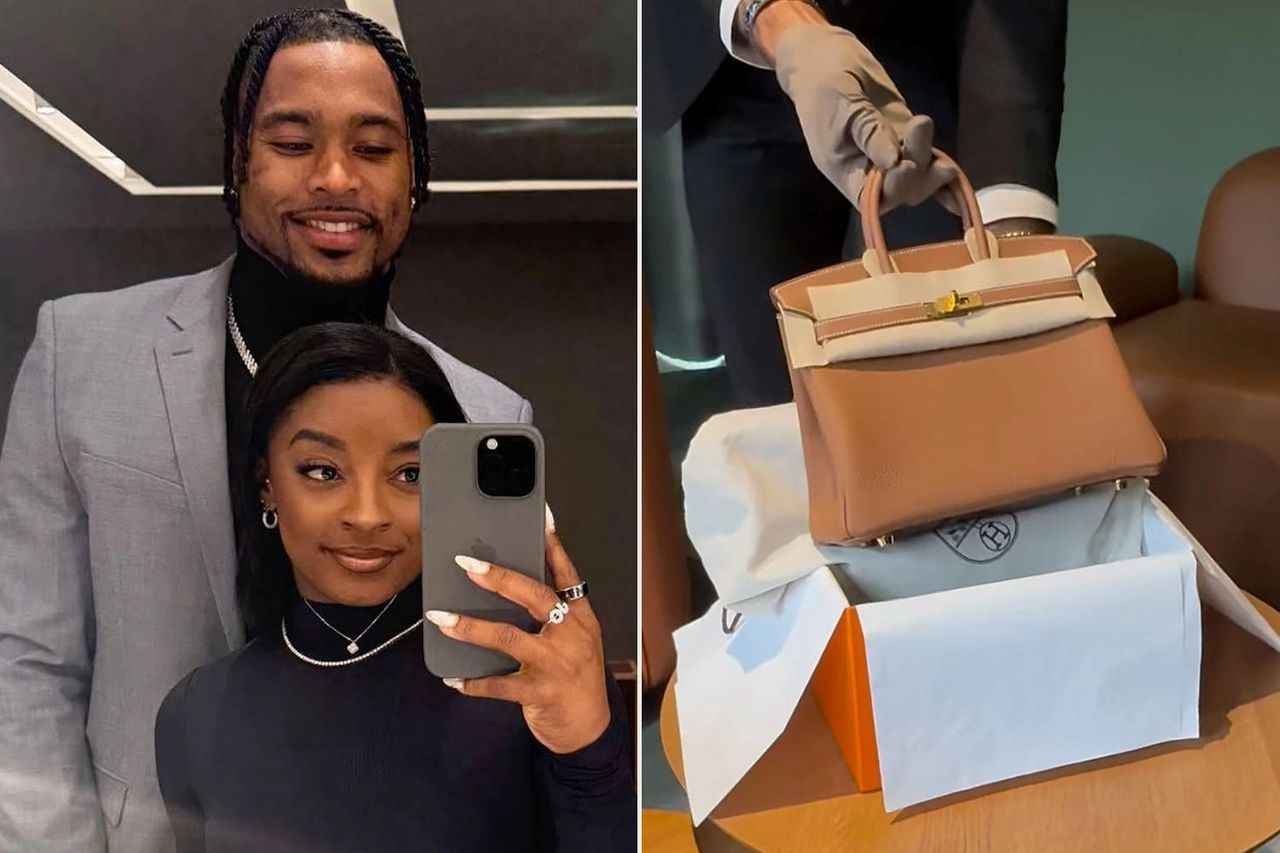 Couple taking a mirror selfie with a luxury handbag.